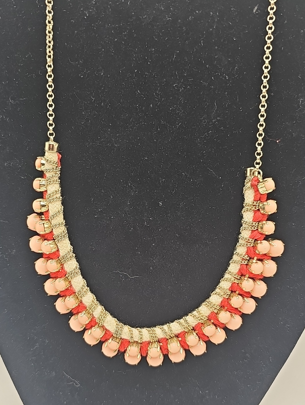 Gold-Tone Necklace with Peach Bead Accents.